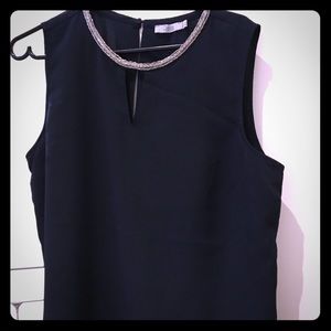 Navy blue blouse, with jewel detail on neckline